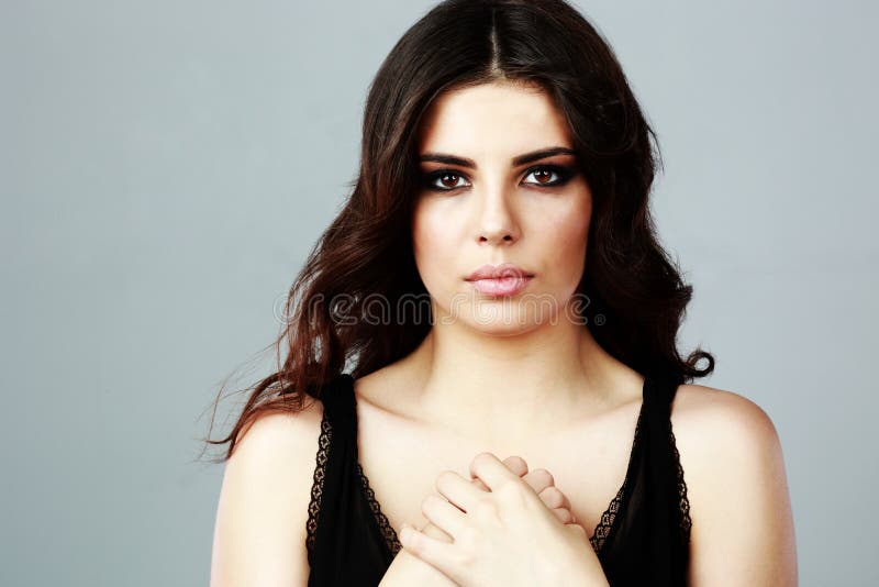 Serious beautiful woman in black dress royalty free stock photo Serious beautiful woman in black dress royalty free stock photo