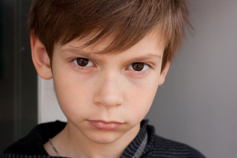 Serious boy stock image. Image of childhood, white, angry - 21644203