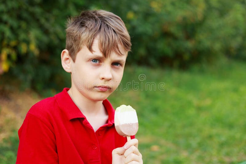 Serious Boy with Ice-cream. Childhood, Emotions and States of Mi Stock ...