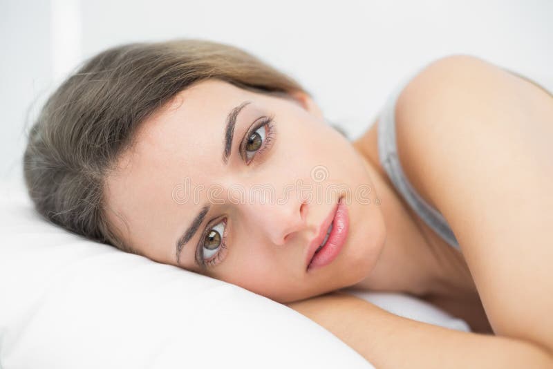 Serious Woman Lying on Her Bed in the Bedroom Stock Image Image of leisure,