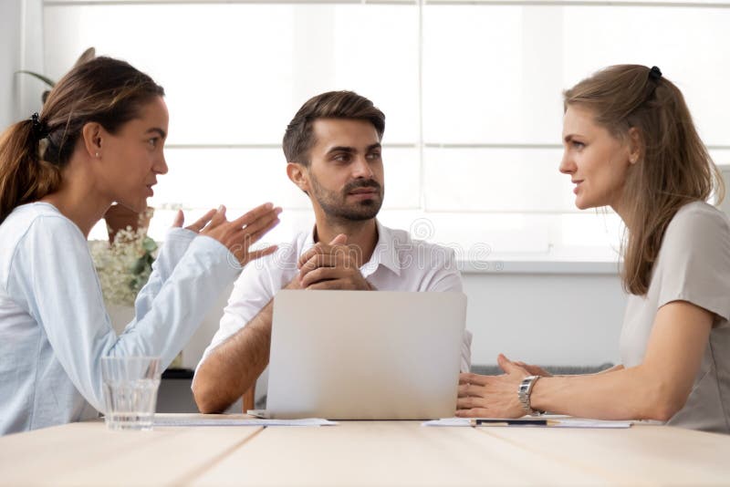 Serious business partners discussing project or business strategy at negotiations royalty free stock photos Serious business partners discussing project or business strategy at negotiations royalty free stock photos