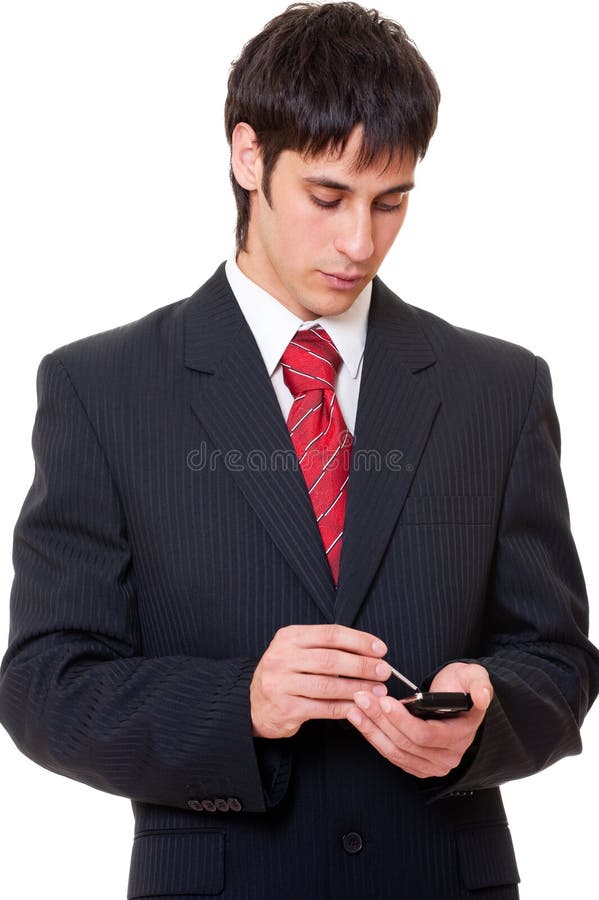 Serious businessman with palmtop stock photos