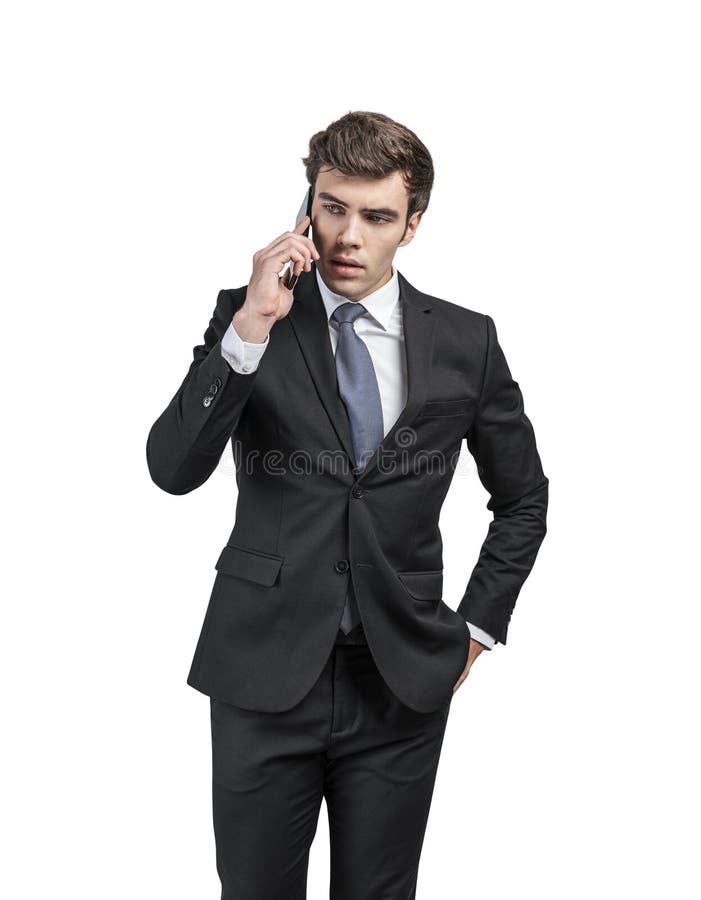 Serious businessman talking on phone, isolated