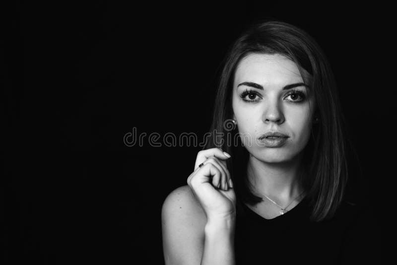 Large Portrait of the Girl`s Profile. Girl`s Face on a Black