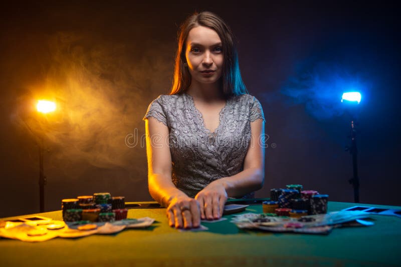 Serious Girl Play Poker in Casino with Poker Face. Poker Cards and Poker  Chips are on the Table Stock Image - Image of black, club: 196106329