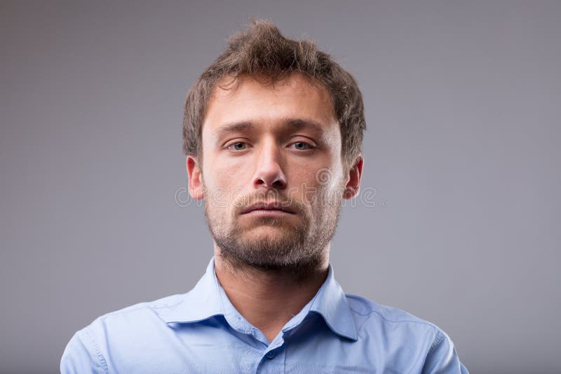 Serious intense young blond man stock image