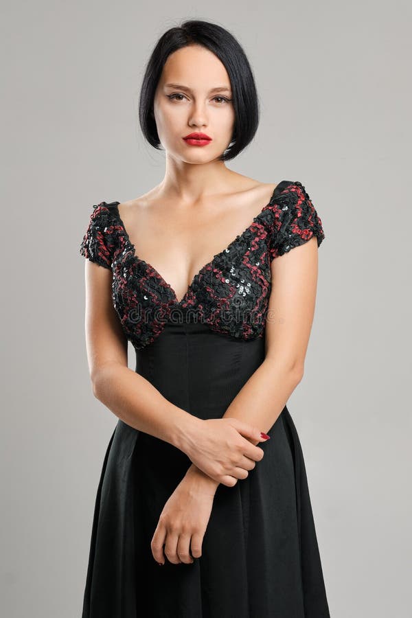 Serious Lady with Short Dark Hair and Red Lips Looking Straight ...