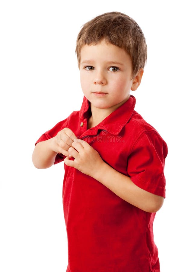 Serious little boy in red shirt