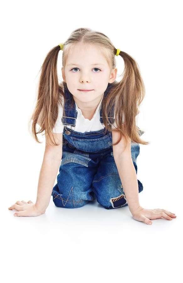 Serious little girl in blue jeans