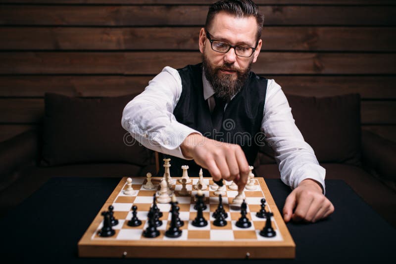 Male chess player with figures in the eyes, thinking process