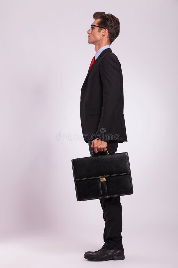 Serious man with suitcase