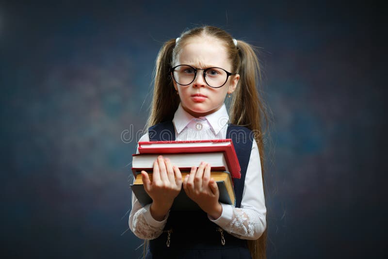 Serious Schoolgirl Wear Glasses Hold Pile of Book