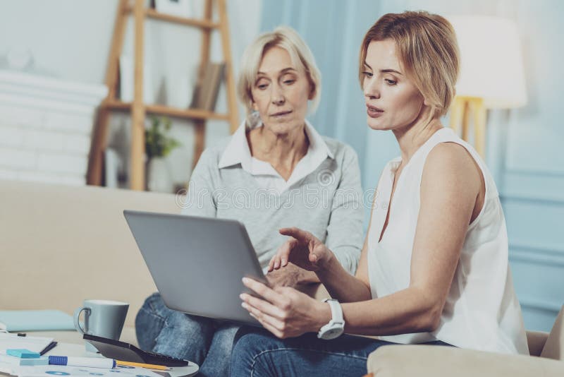 Serious smart women working on their project stock photos Serious smart women working on their project stock photos