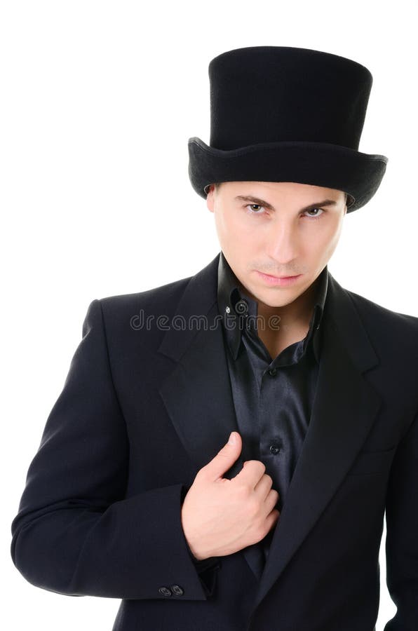 Serious strick man illusionist in black stock photos Serious strick man illusionist in black stock photos