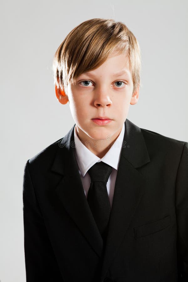 Serious Young Boy Wearing Black Suit Stock Photo - Image of business ...