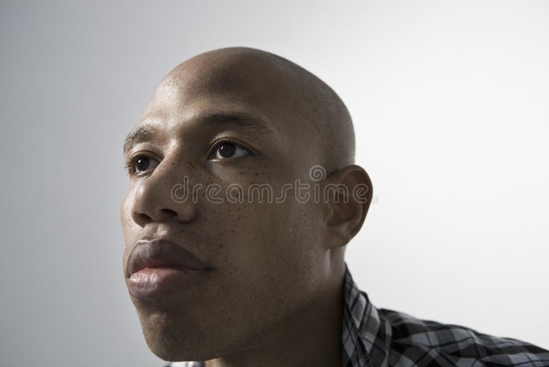 Serious Young Man Looking Up