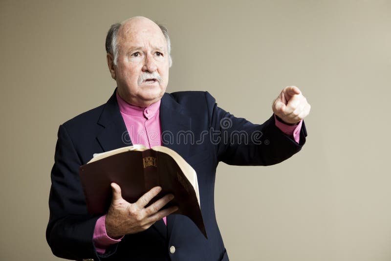 Minister delivering a serious sermon in church. Room for text. Minister delivering a serious sermon in church. Room for text.