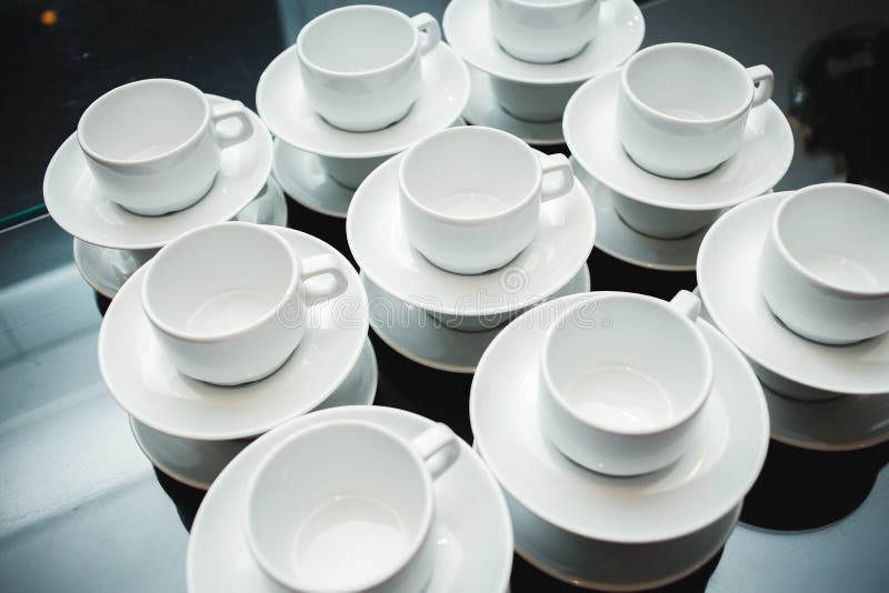 Served with cups and saucers on the table stock photography Served with cups and saucers on the table stock photography