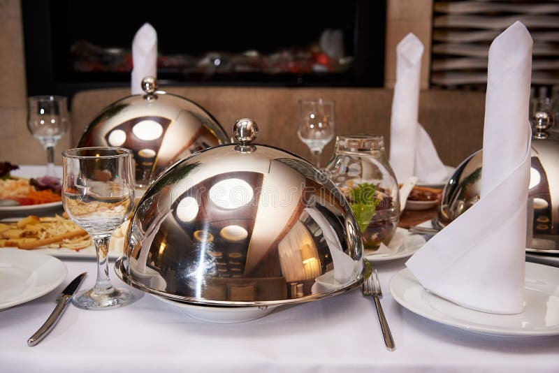 Served Dinner Table.Hot Dish on the Dome Tray on the Server Table Stock