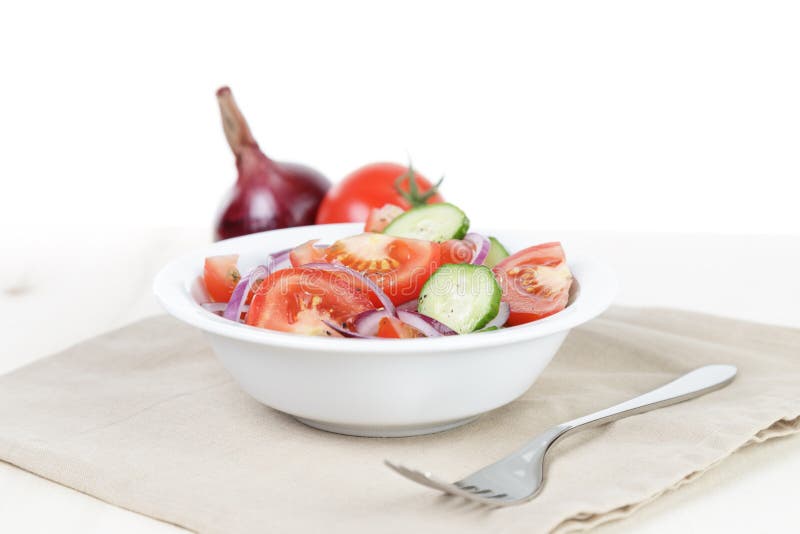 Served plate with mix salad from tomatoes and cucumbers