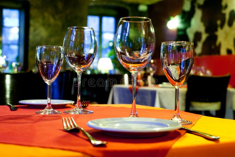 Served table with a bright tablecloth, napkins stock photo Served table with a bright tablecloth, napkins stock photo