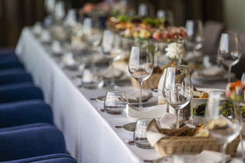 Served table in a restaurant for receiving guests stock images