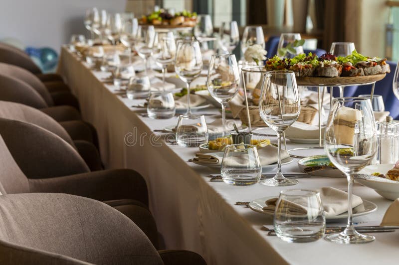 Served table in a restaurant for receiving guests stock photography