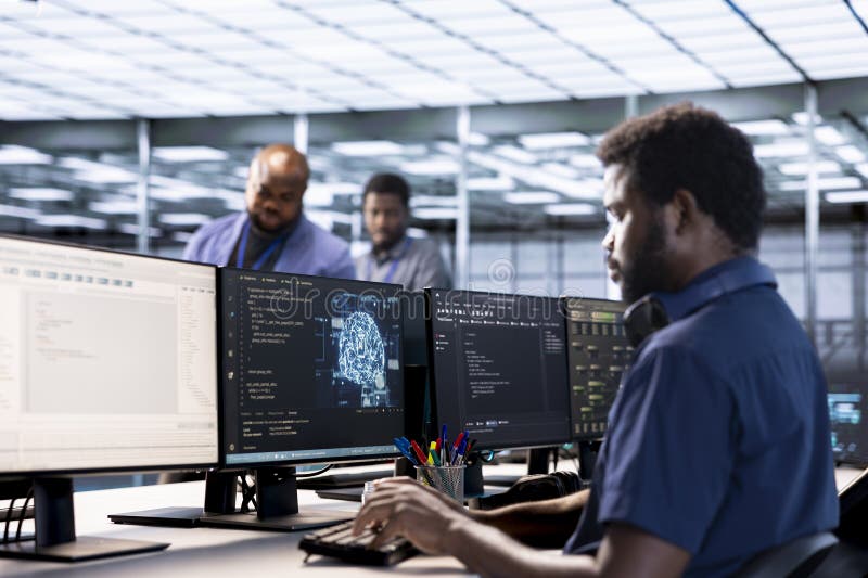 Server farm IT specialist using AI systems to input data faster stock photos