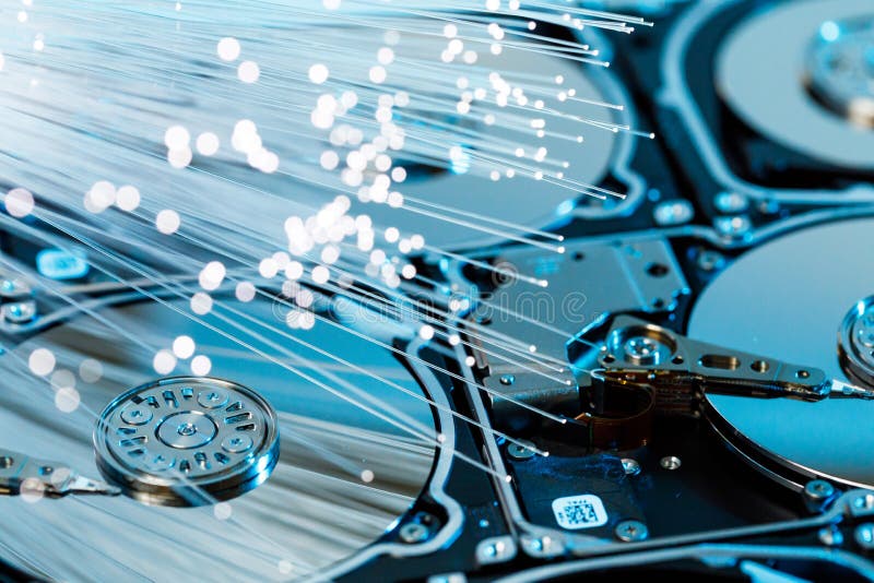 Server hard disks, illuminated optical fiber with blurred lights royalty free stock photo