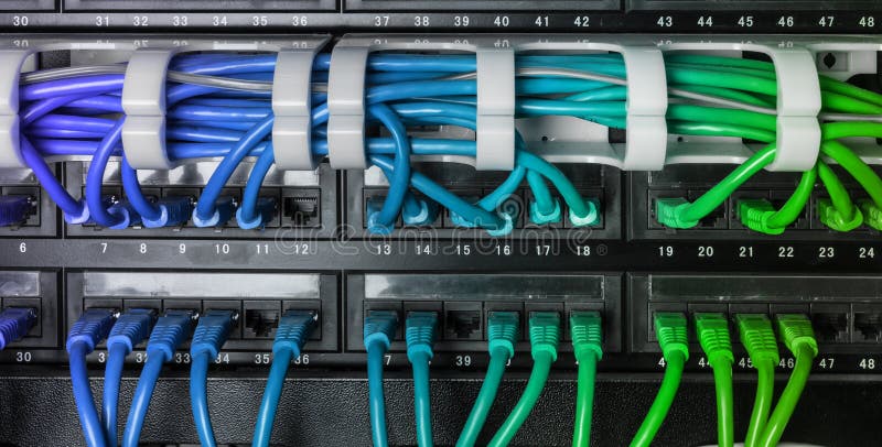 Server rack with blue internet patch cord cables stock photo