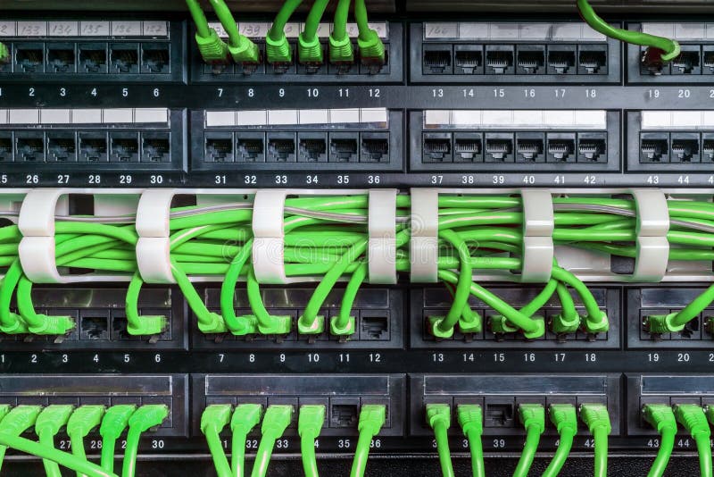 Server rack with green cables stock photo