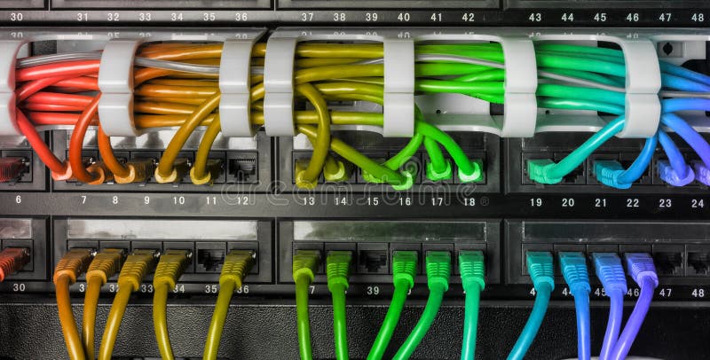 Server rack with rainbow internet patch cord cables royalty free stock images