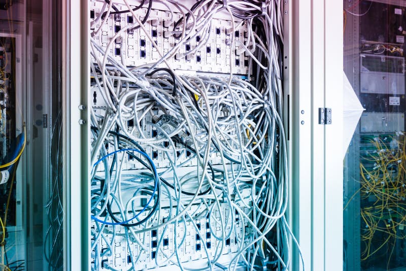Server rack with switch boards and cables stock photo