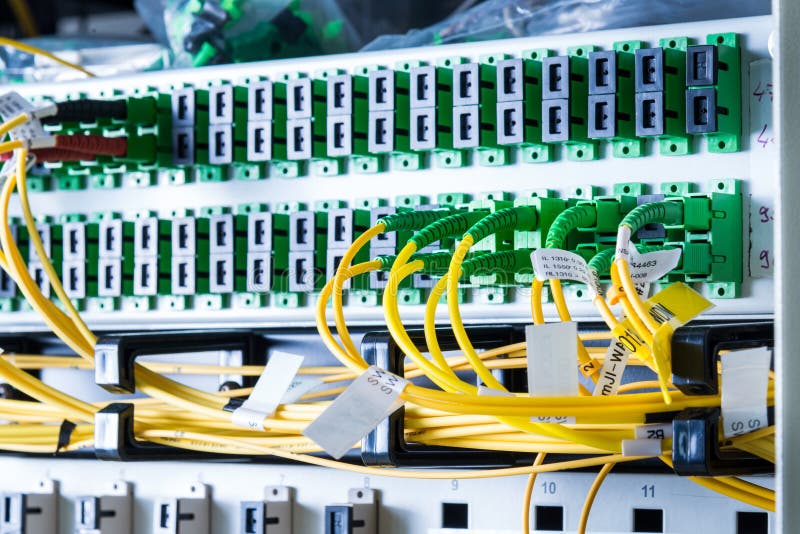 Server rack with switch boards and cables stock image