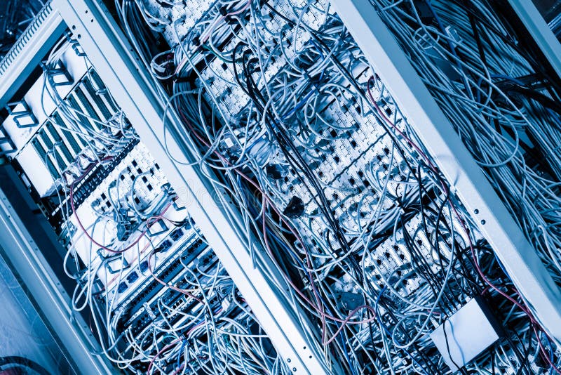 Server room rack with tangled network cables creating messy unti royalty free stock images