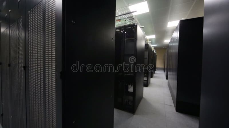 Server room with telecommunication racks and blue stock footage