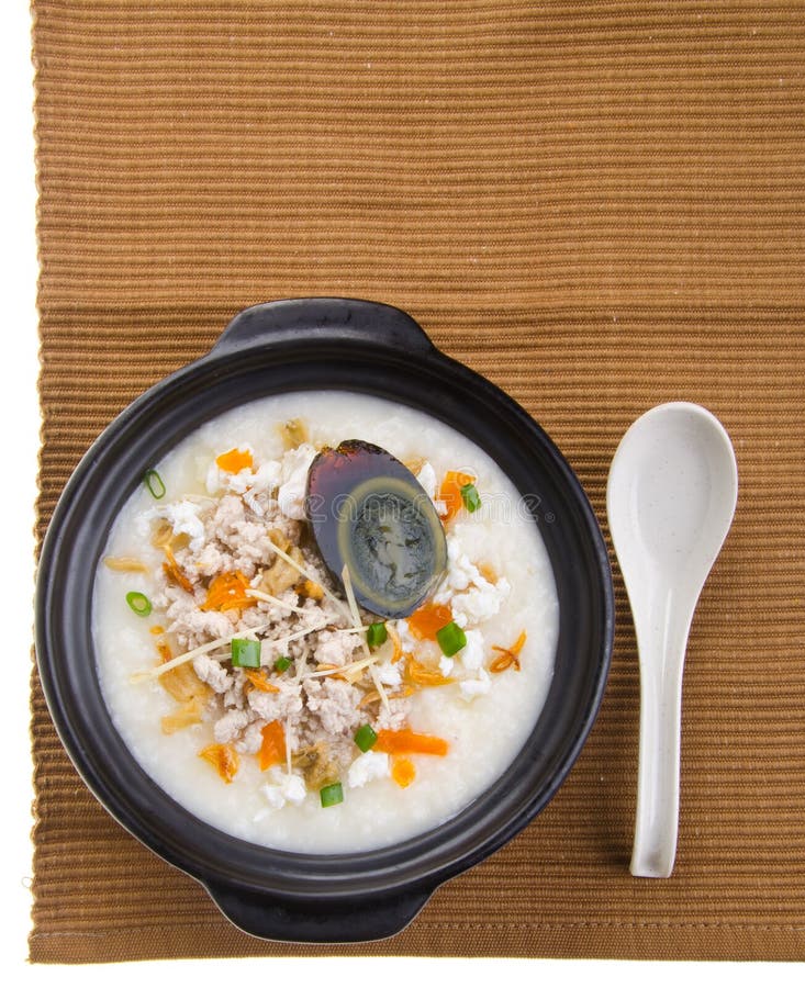 Service de gruau de riz de gruau d'oeufs et de porc de siècle images stock Service de gruau de riz de gruau d'oeufs et de porc de siècle images stock