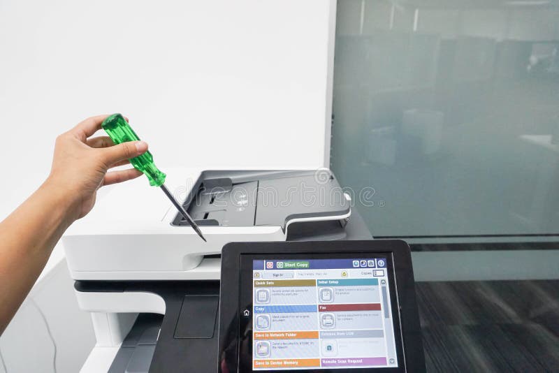 Service Engineer with Screwdriver To Repair and Maintenance Office