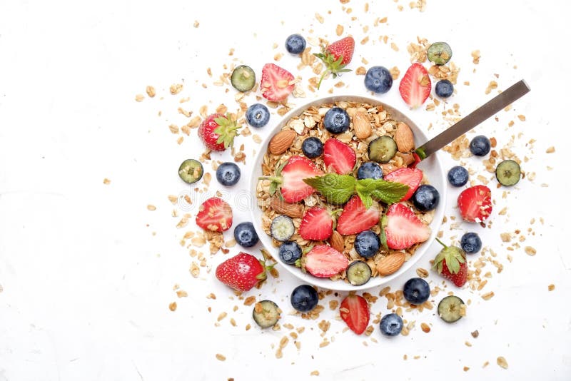 Ceramic granola bowl, assorted ingredients on table. Healthy nutritious breakfast with vegan yogurt, raw fruits, nuts and cereals. stock photos Ceramic granola bowl, assorted ingredients on table. Healthy nutritious breakfast with vegan yogurt, raw fruits, nuts and cereals. stock photos