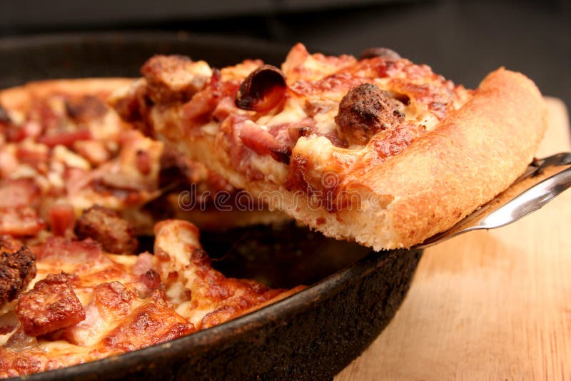 A slice of hot, fresh pizza being served. A slice of hot, fresh pizza being served