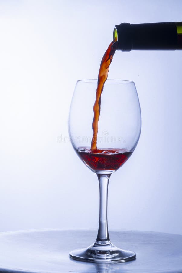 Serving a Single Glass of Red Wine from a Bottle Stock Photo Image of