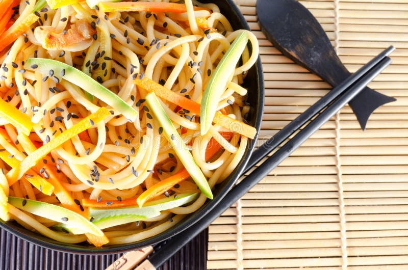 Serving of Spaghetti with Carrots and Zucchini and Soy Sauce Stock