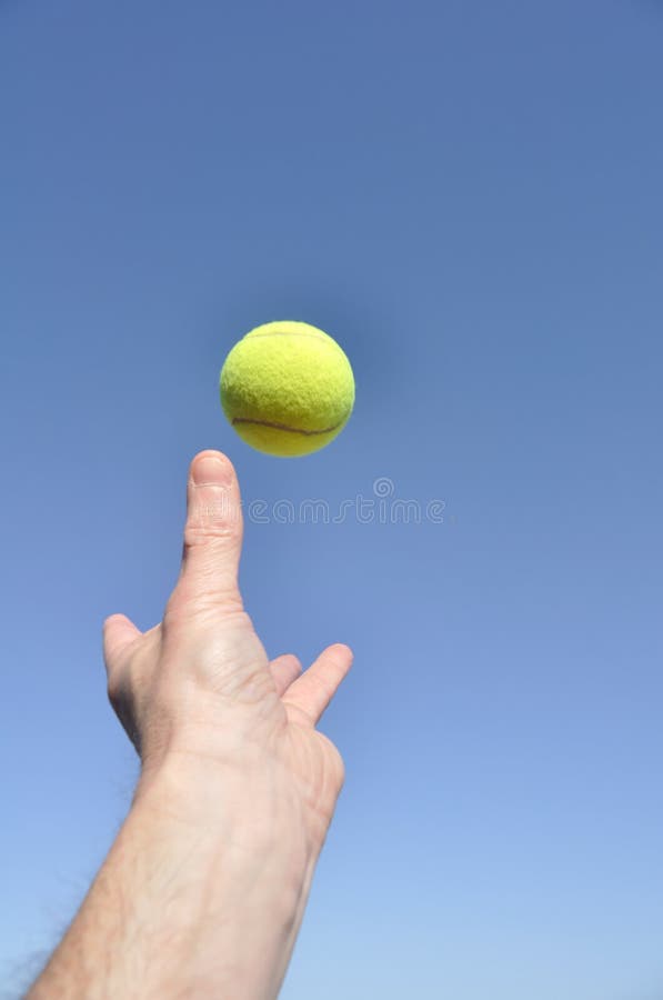Serving a Tennis Ball stock photo. Image of hand, player 13950836