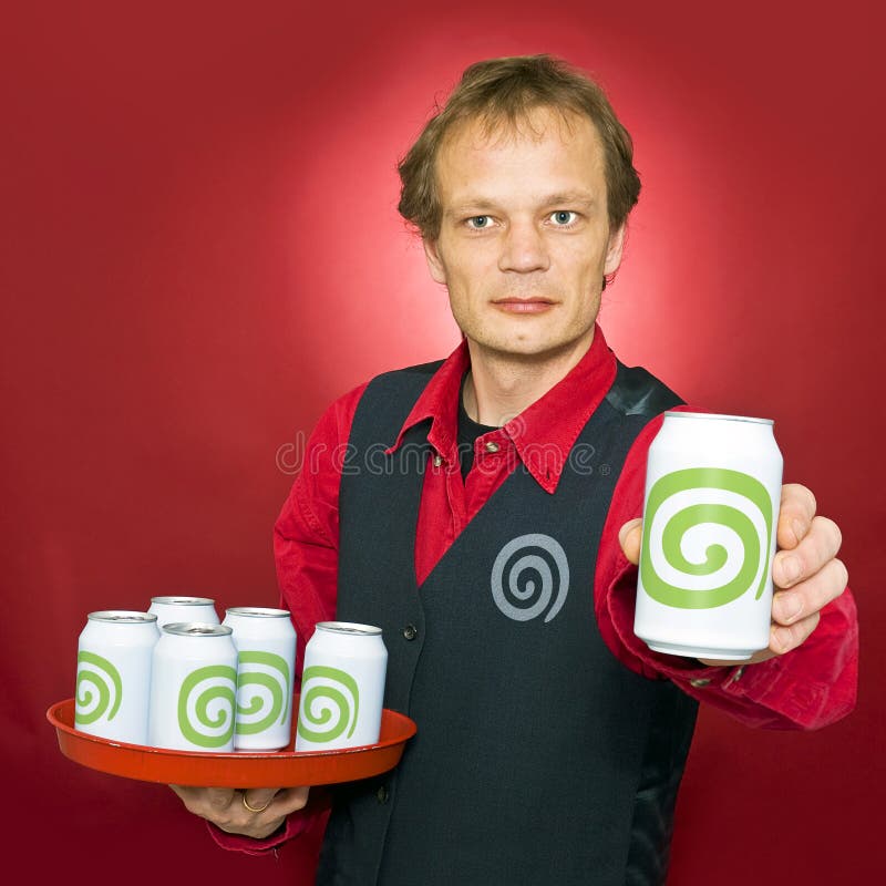 A waiter, holding a tray of dreamstime cans offering a dreamstime to the customer. A waiter, holding a tray of dreamstime cans offering a dreamstime to the customer