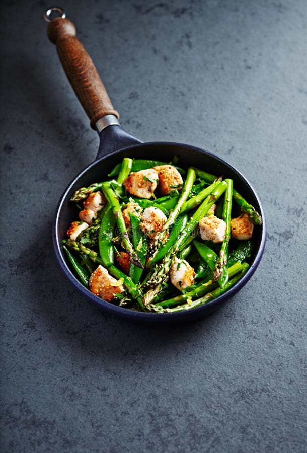 Sesame Chicken with Green asparagus and Sugar Snap Peas flavoured with lemon peel stir fry