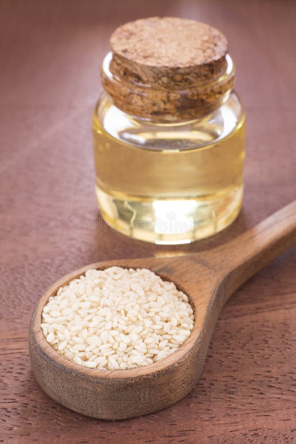 Sesame Oil in Glass Jar and Sesame Seeds on Wooden Spoon - Sesamum ...