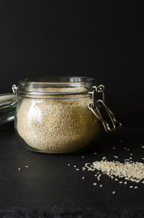 Sesame Seeds in a Jar, on a Black Background Stock Photo Image of