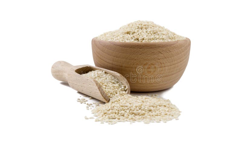 Sesame seeds in wooden bowl and scoop isolated on white background. Spices and food ingredients.