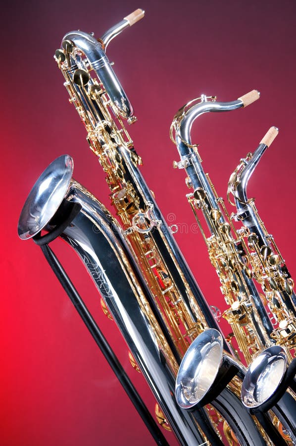 Set of 4 Saxophones stock image. Image of dark, four, isolated 7461665