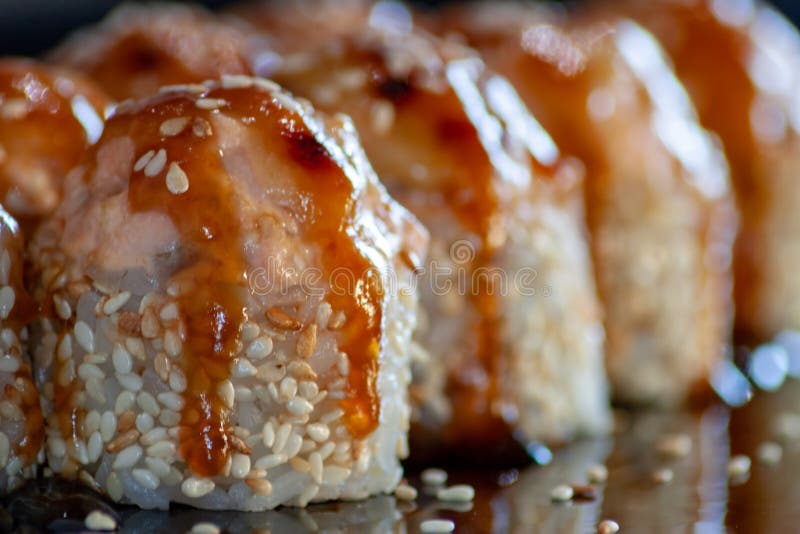 Set of baked sushi with tuna and unagi sauce